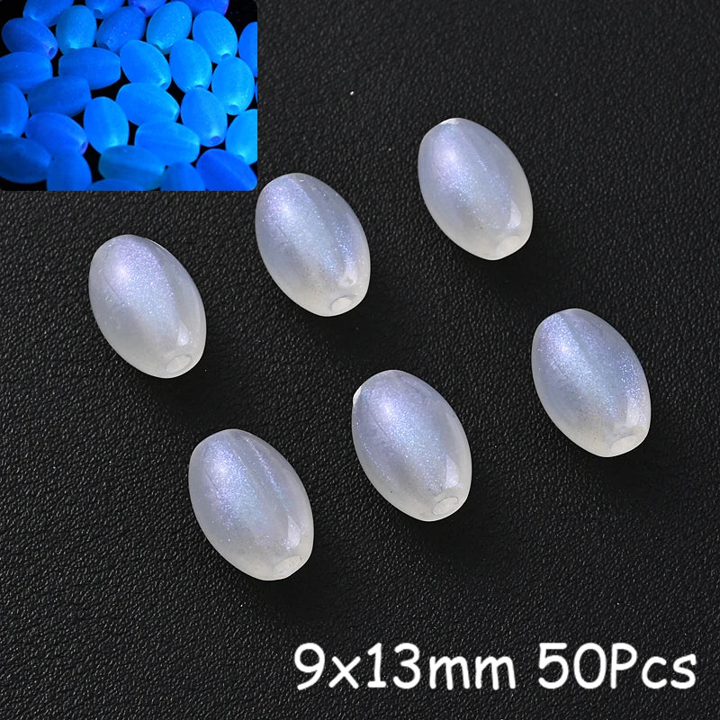 50 pieces of luminous glow-in-the-dark acrylic beads, oval shaped, on a black surface.