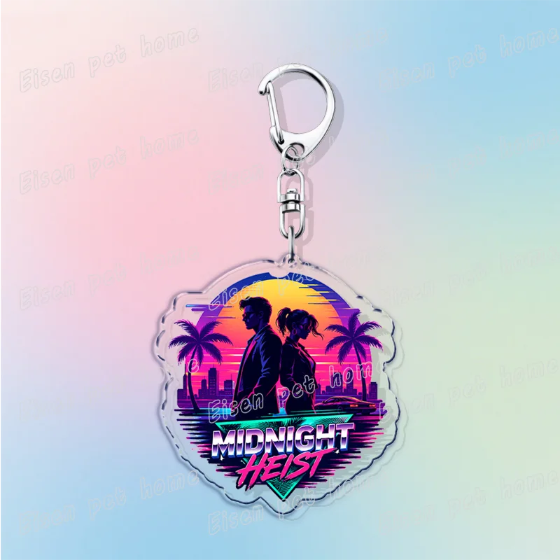 Silver pendant keychain featuring a silhouette of two figures against a sunset tropical background with the text MIDNIGHT HEI