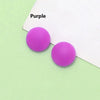 Two purple silicone eyeglass grips resting on a white background.