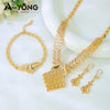 A set of luxury gold plated bridal jewelry including a necklace and earrings displayed on a white background.