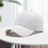 A light gray unisex cotton curved visor hat is displayed on a white table.