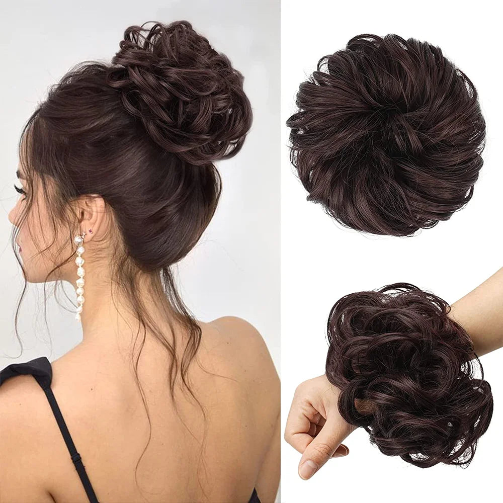 A dark brown messy bun hairstyle featuring hair pieces and scrunchies.