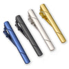 A set of four 14K copper classic tie clip jewelry pieces in blue, black, silver, and gold.
