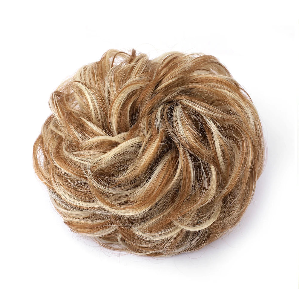 A voluminous, messy bun hairstyle made from light brown and blonde hair.
