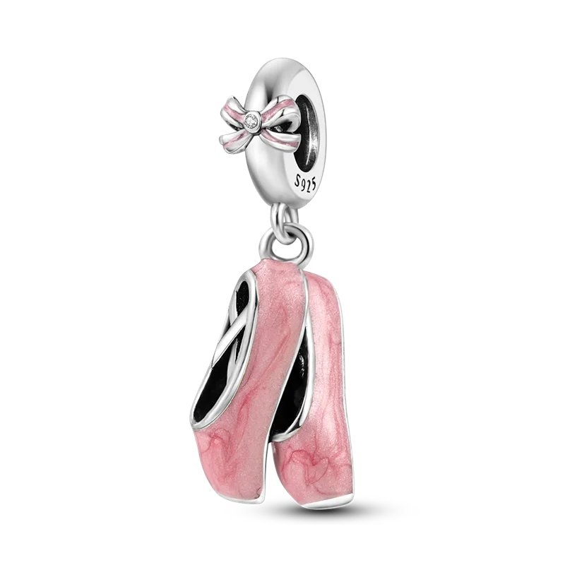 Sterling silver devil's eye charm bracelet featuring a pink marbled pendant and a bow charm.