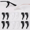 A collection of black silicone anti-slip ear hooks for eyeglasses, shown in various shapes and angles.