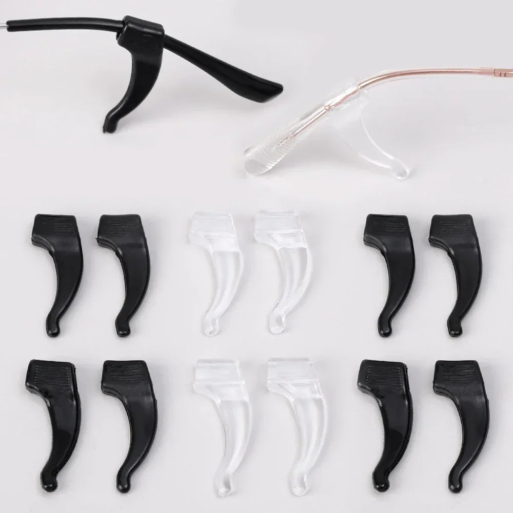 A collection of black silicone anti-slip ear hooks for eyeglasses, shown in various shapes and angles.
