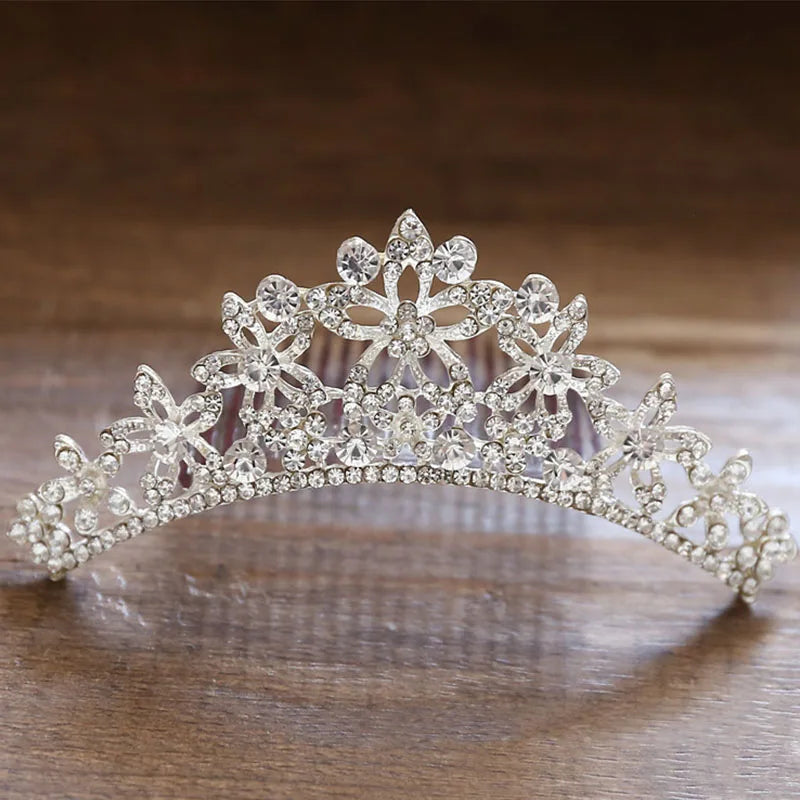 A sparkling crystal princess tiara hair comb for women with floral designs.