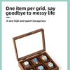A wooden watch storage box with multiple slots displaying several wristwatches and jewelry.