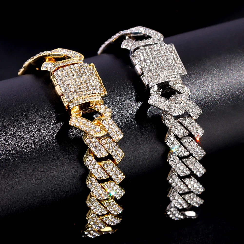 A pair of crystal Cuban link anklets shown in gold and silver options against a dark background.