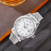 A silver-toned quartz wristwatch with a metal bracelet and a white face displaying Arabic numerals.