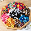 A colorful pile of nylon elastic hair cords in various bright and dark colors for kids headbands.