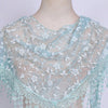 A sheer light blue floral lace scarf draped around a mannequin's neck and shoulders.