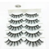 A set of black 3D mink false eyelashes displayed in a white tray.