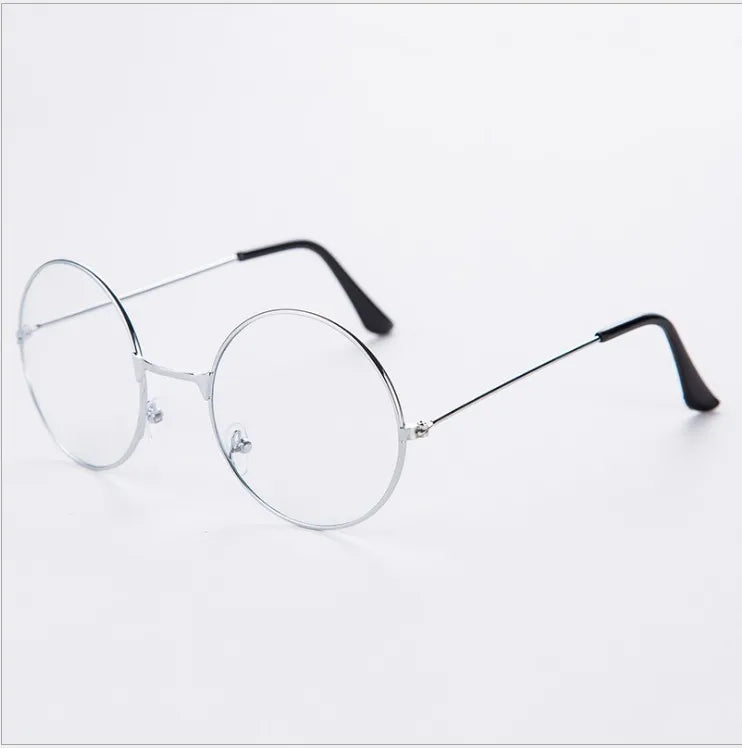 Un par de gafas redondas de metal anti-luz azul con patillas negras delgadas sobre un fondo blanco.
