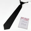A black butterfly ribbon tie is shown against a white background.