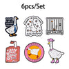 A set of six enamel pins featuring various cute goose designs and related text.