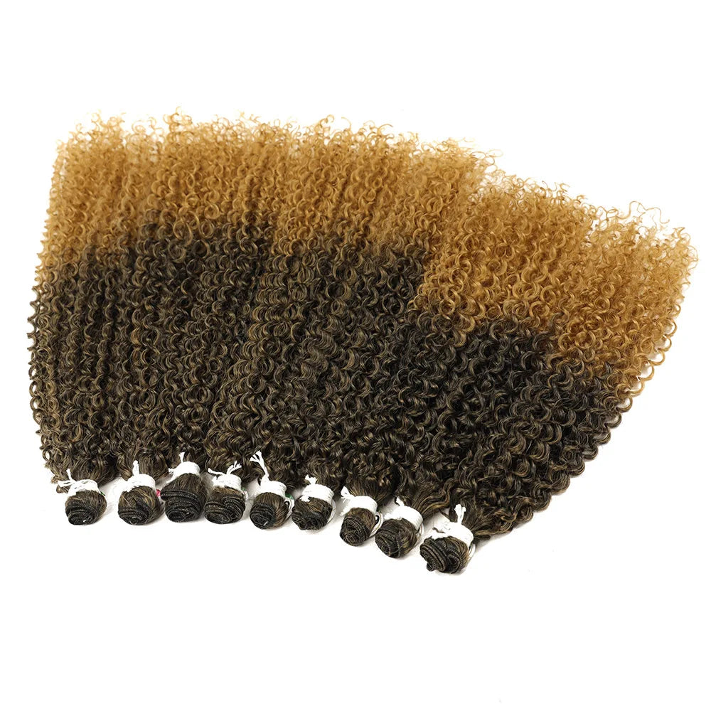 A bundle of long curly hair extensions showing a gradient from dark brown to light blonde.