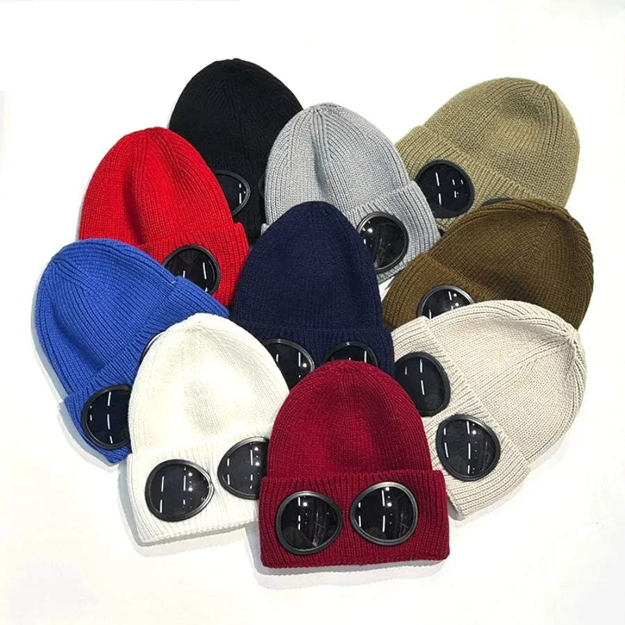 A collection of various knit windproof hats in colors including black, red, blue, gray, and olive green.
