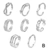 A set of silver adjustable open toe rings for women displayed in various styles.