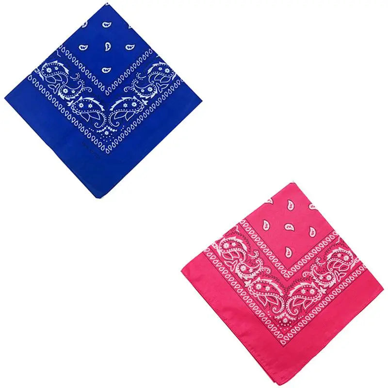 A vibrant pink cotton bandana scarf featuring white paisley patterns.