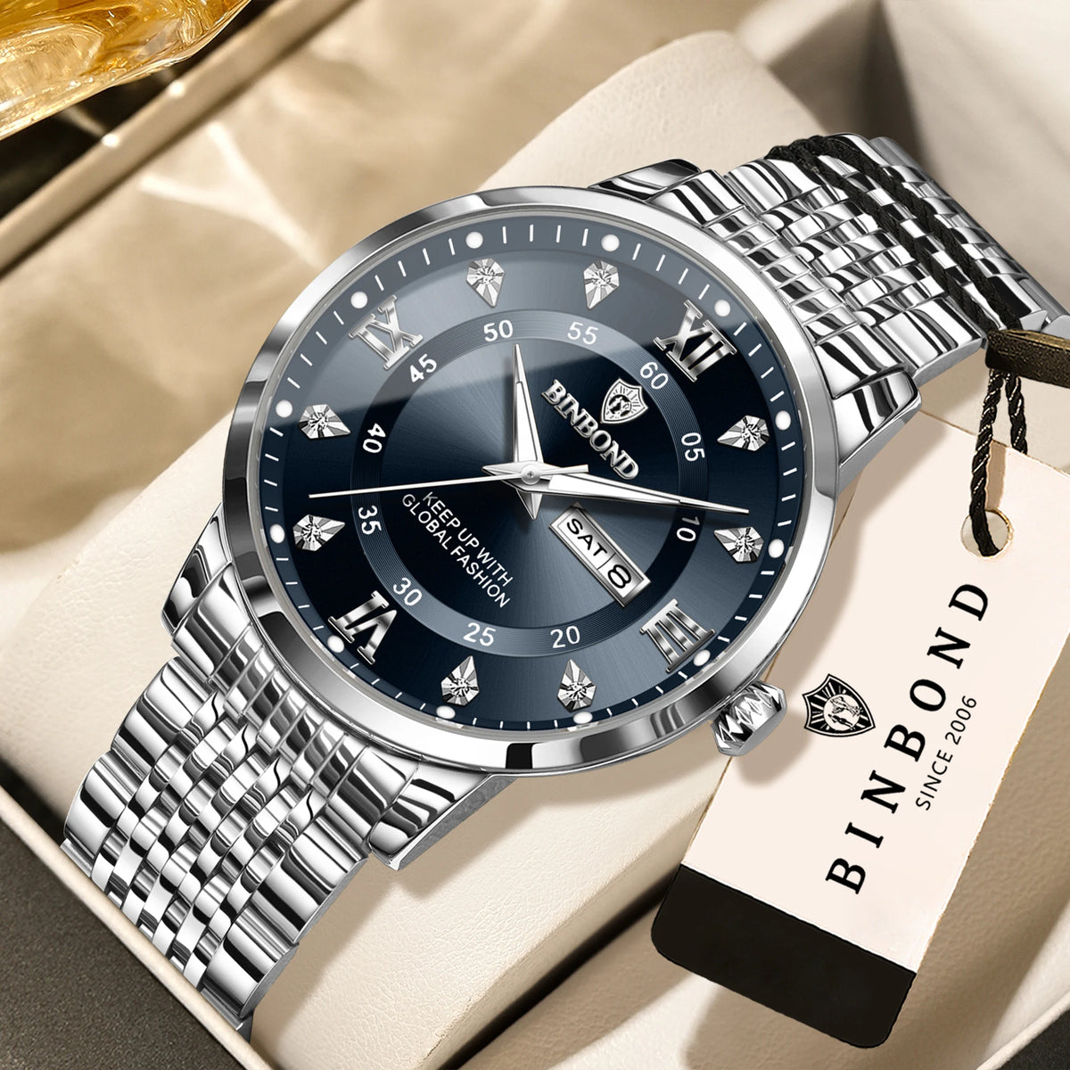 A silver fibond watch with a metal bracelet is displayed on a light background.