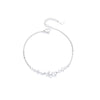 Sterling silver double heart charm bracelet with a delicate chain and small charms