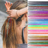 Close-up of a woman's hair with colorful glitter extensions being braided, displayed alongside a color spectrum chart.