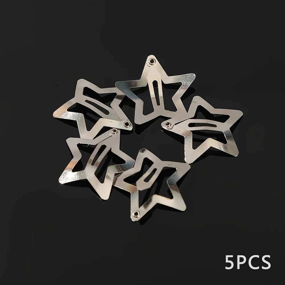 Five silver metal star-shaped hair clips arranged in a circle against a dark background