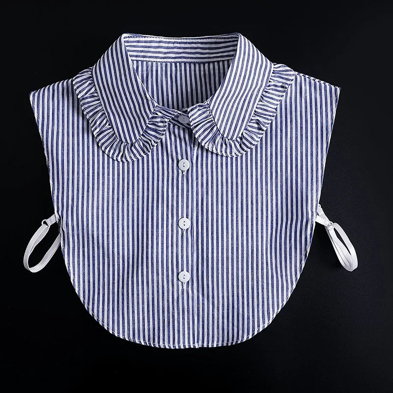 A striped blue and white blouse with a ruffled false collar and tie-back details.