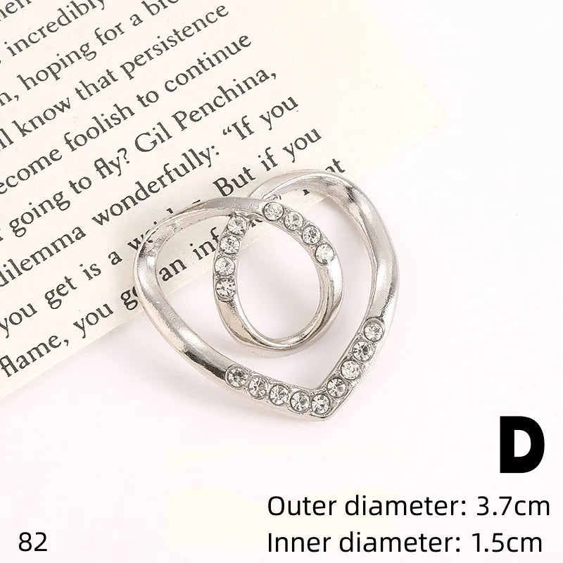 Silver hoop earrings with pave-set rhinestones and pearl accents.