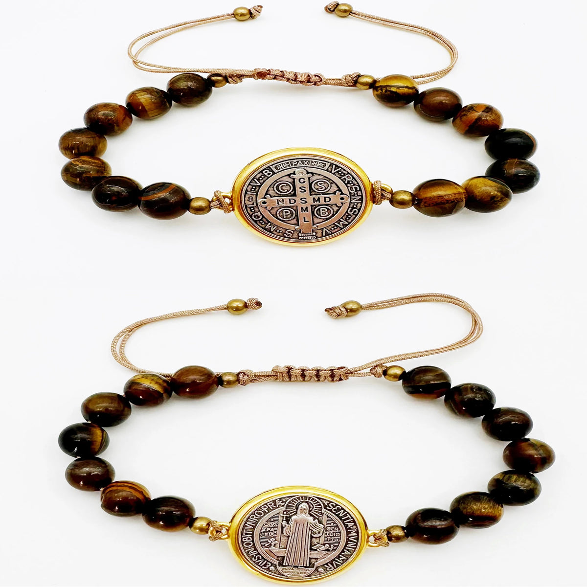 A set of two beaded medal charm bracelets with gold-toned wire closures and medallions.