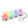 A set of colorful LED fidget keychains shaped like miniature keyboards.