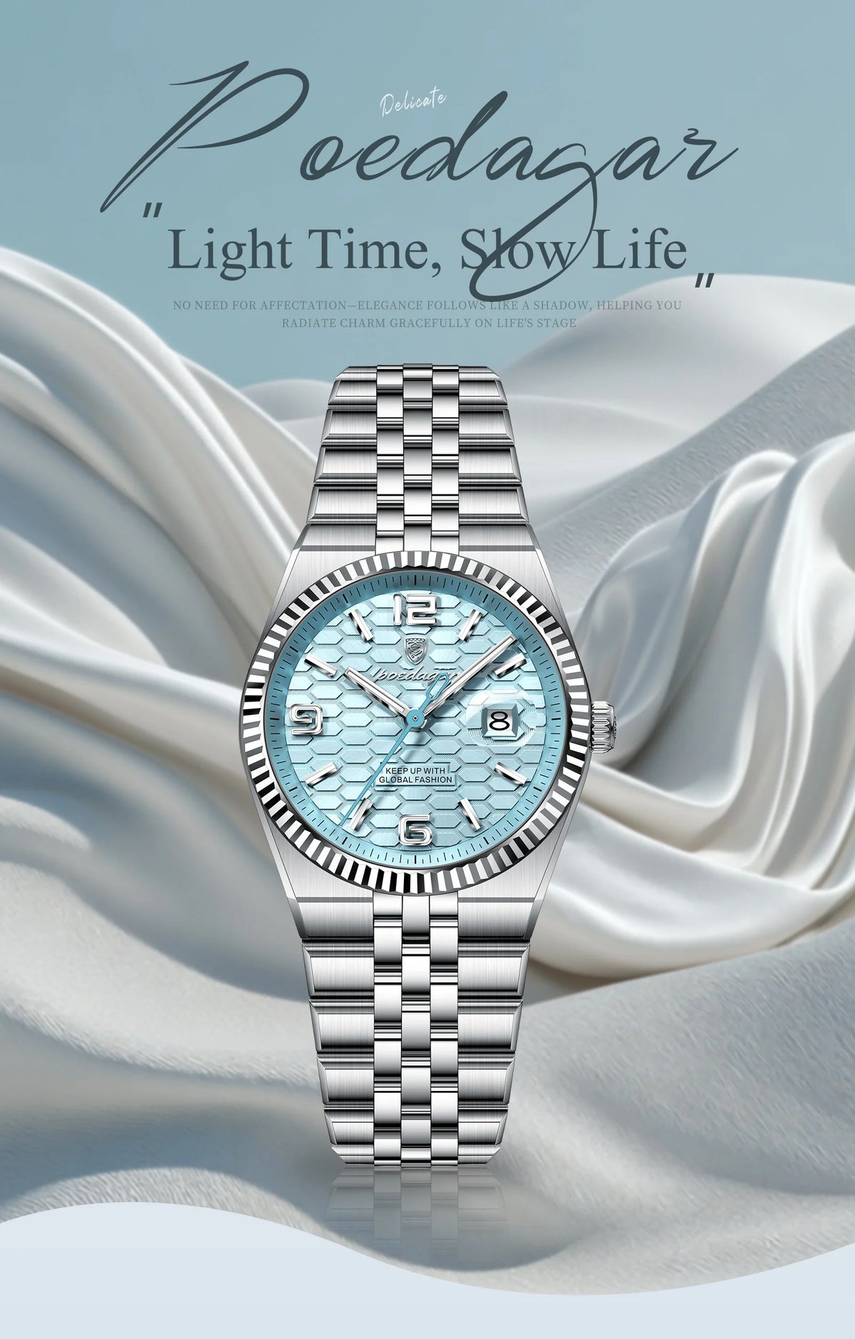 A silver-toned luxury quartz women's wristwatch with a light blue dial and luminous features resting on draped fabric.