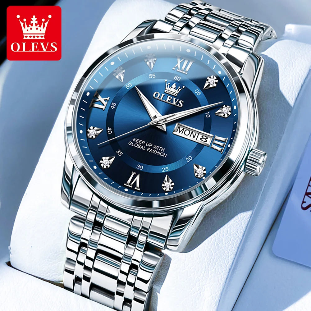 A close-up shot of a stainless steel OLEVS watch with a blue dial and silver bracelet resting on a white background.