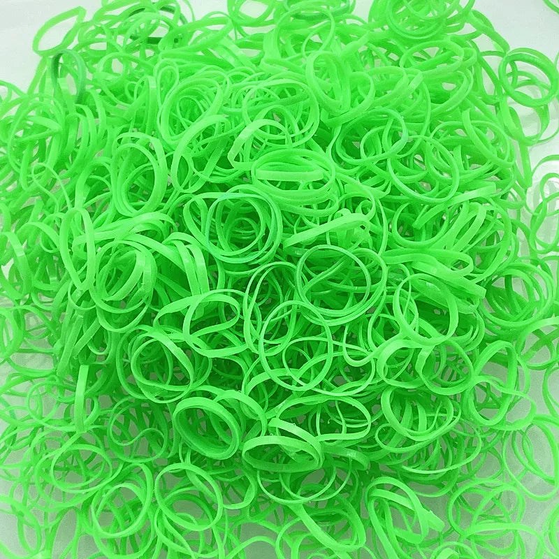 A pile of bright green disposable hair scrunchies for ponytail holders.