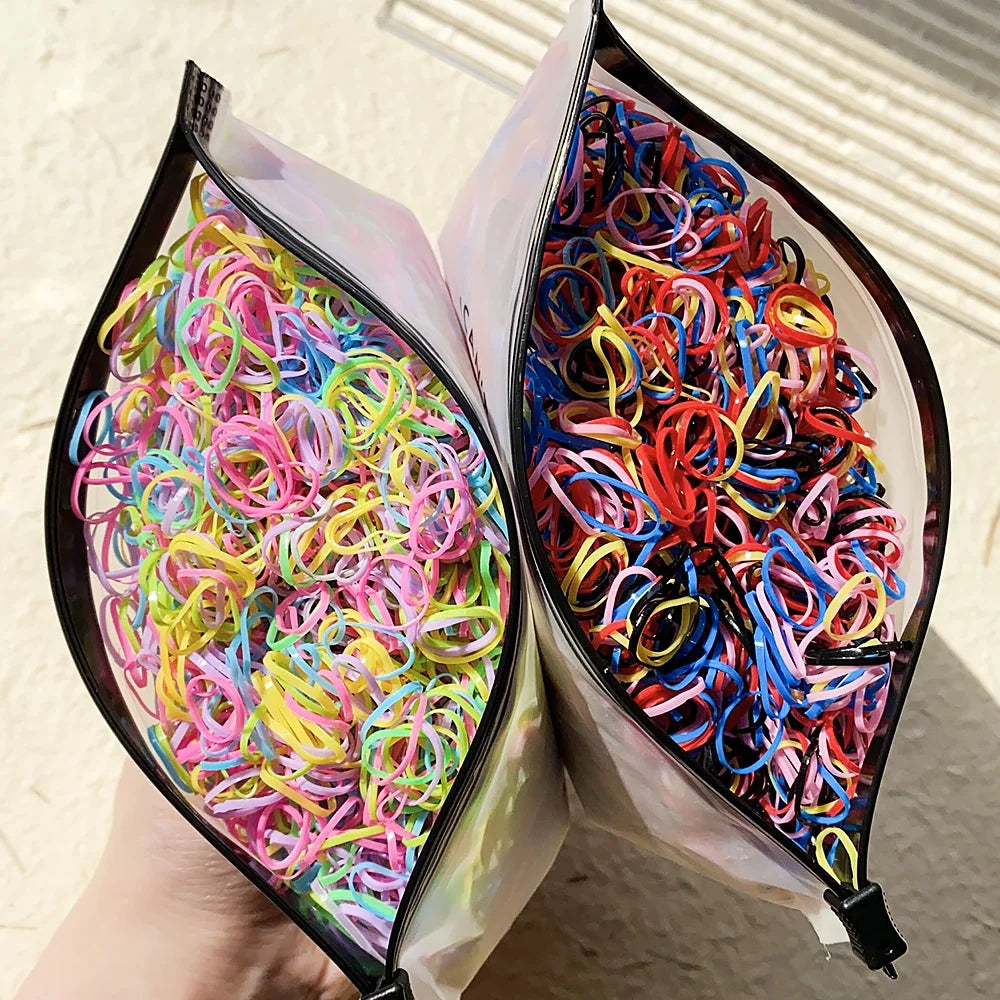 A pair of colorful disposable rubber hair ties, featuring various bright colors like pink, yellow, and blue, are shown in an 