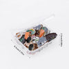 A clear plastic container filled with a variety of cute random fashion pins and badges.
