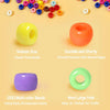 A collection of colorful acrylic pony beads in various sizes and colors displayed on a light yellow background.