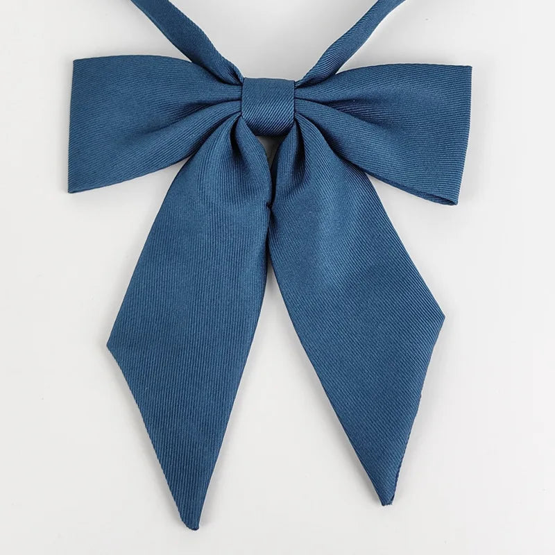 A navy blue butterfly ribbon tie set tied in a bow.