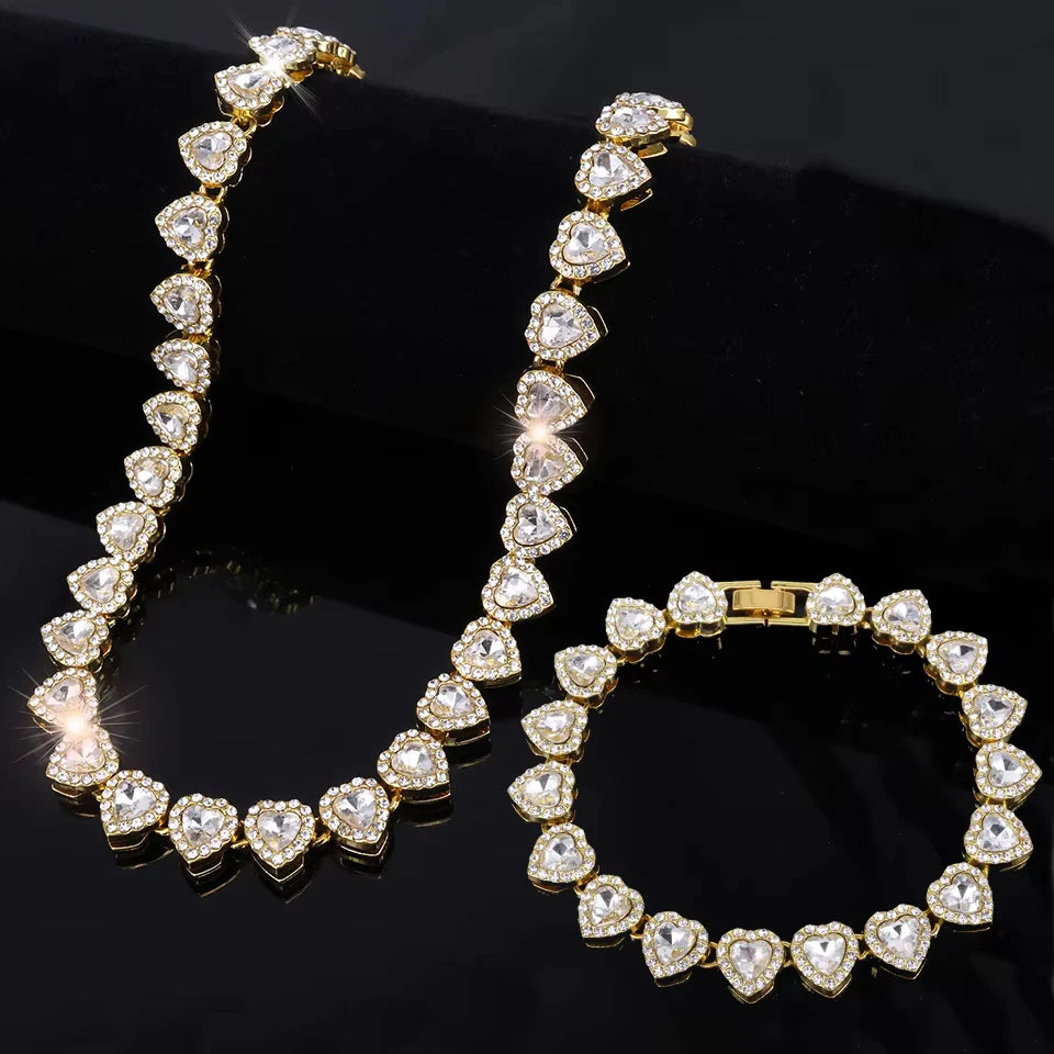 A set of sparkling heart rhinestone necklaces and bracelets displayed on a black background.