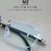 Frameless diamond cut reading glasses with green tint shown on a light gray background