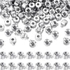 A close-up view of various silver jewelry findings stoppers and spacers for connectors.