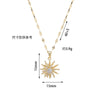 Collier en or avec pendentif de fleur zircon éclatante à rayons solaires sur une chaîne délicate.