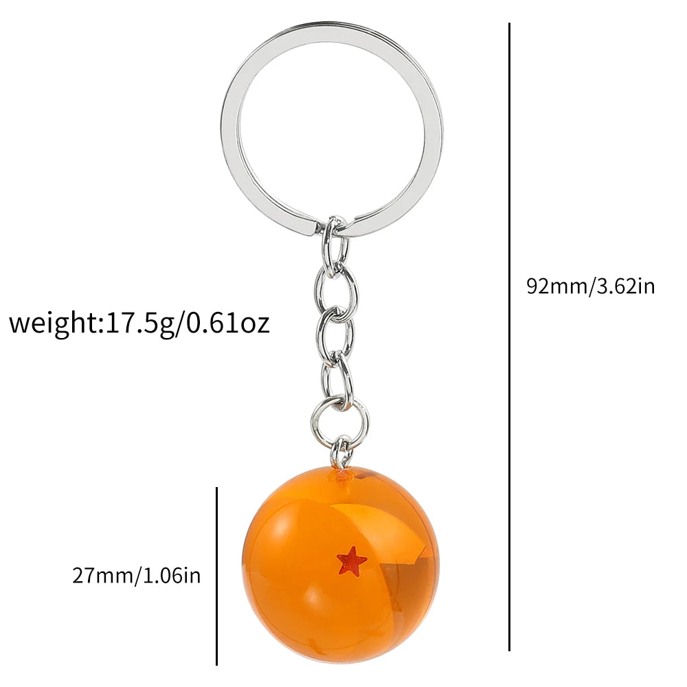 A round, orange glass charm with a small red star attached to a silver keyring.