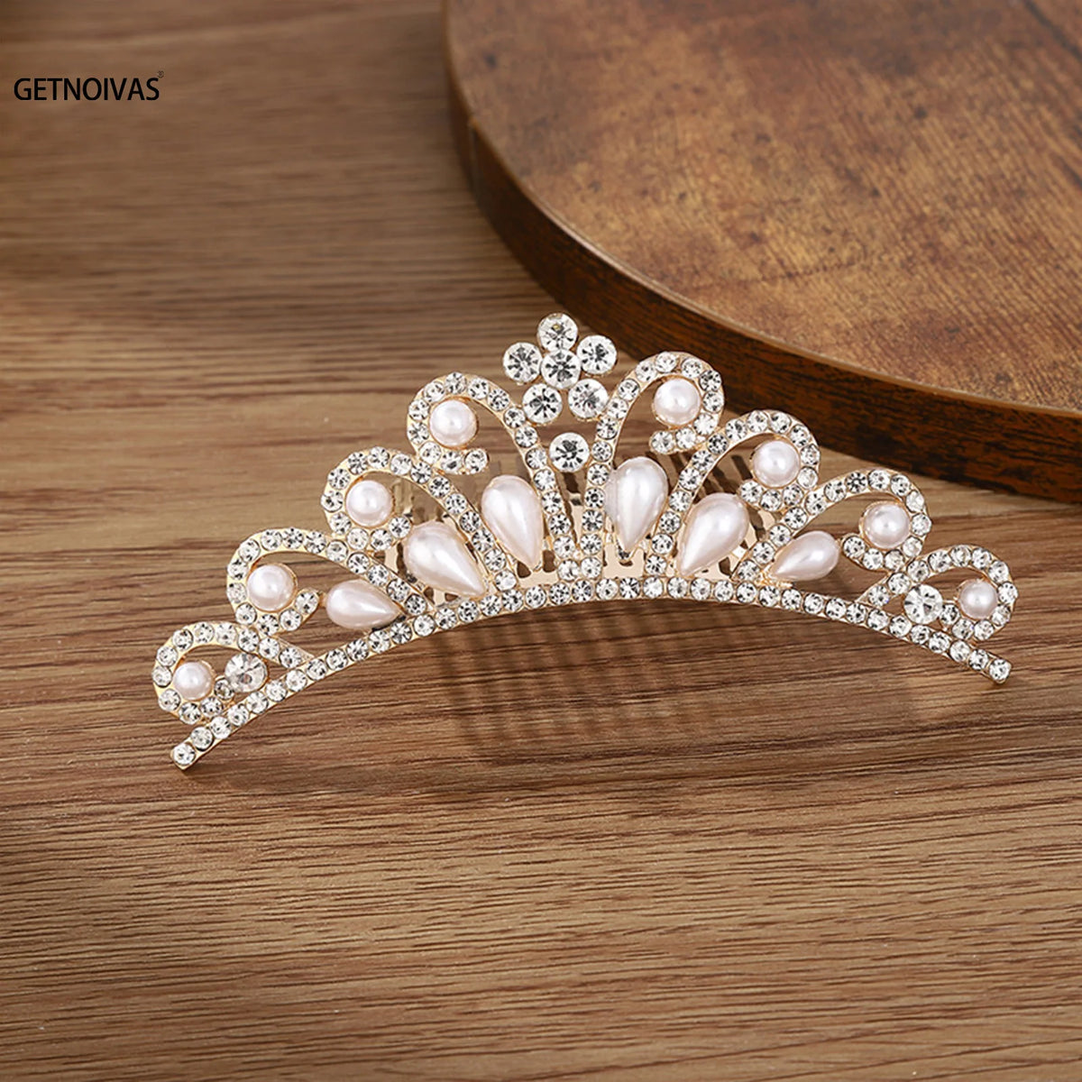 A sparkling crystal princess tiara hair comb for women featuring pearls and clear crystals.