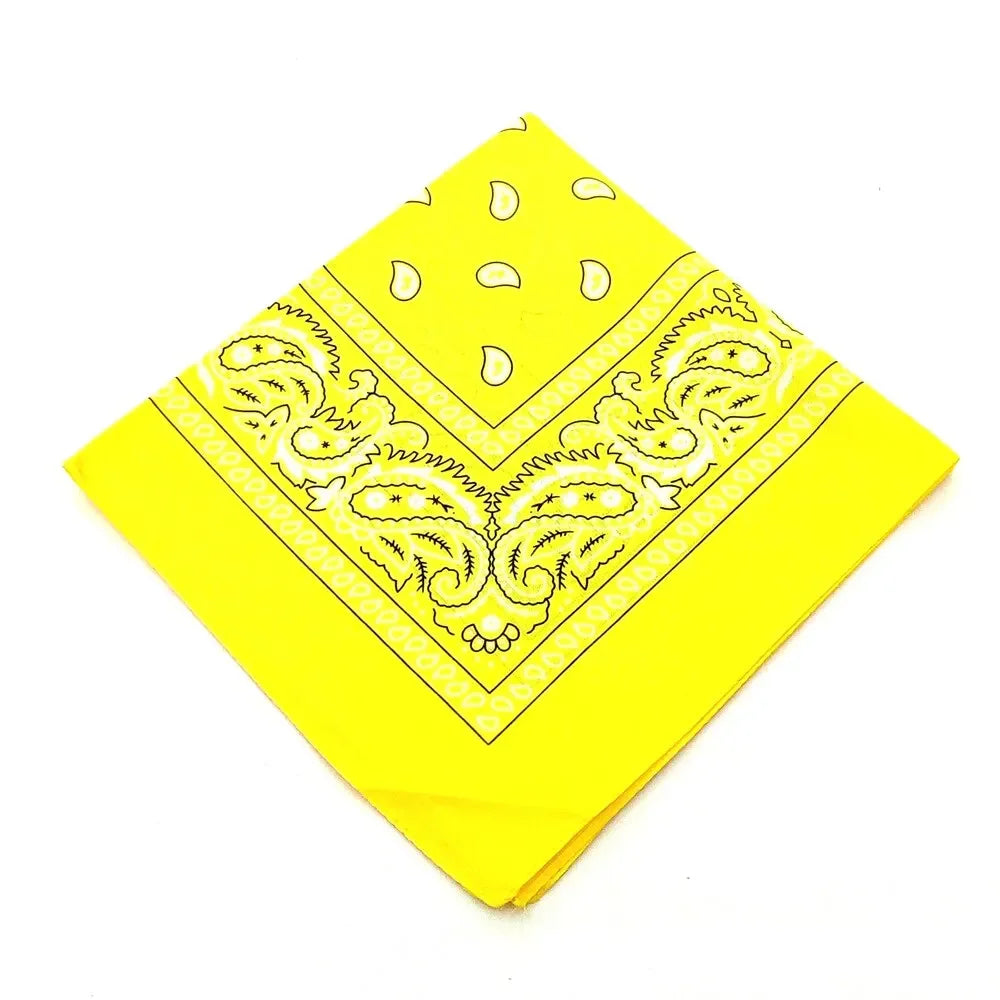 Yellow fabric bandana featuring black paisley and geometric patterns