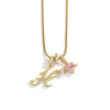 A gold-toned alphabet flower pendant necklace featuring an ornate letter and a pink gemstone accent.