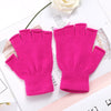 A pair of bright pink knit half finger gloves displayed on a white background.