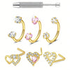 Three pieces of stainless steel heart horseshoe nose studs featuring clear and pink gemstones.